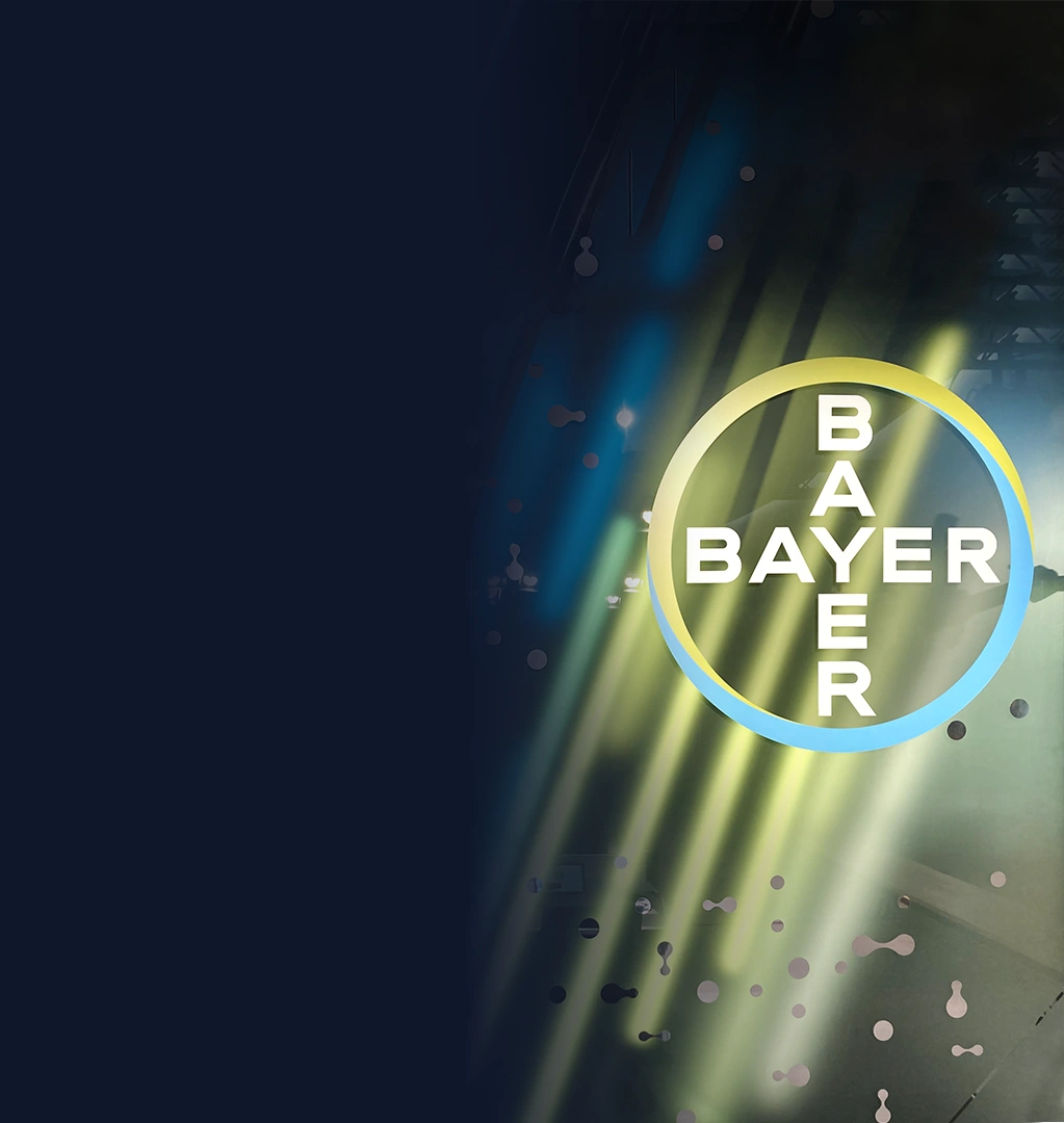 Bayer-Logo vor buntem Hintergrund.