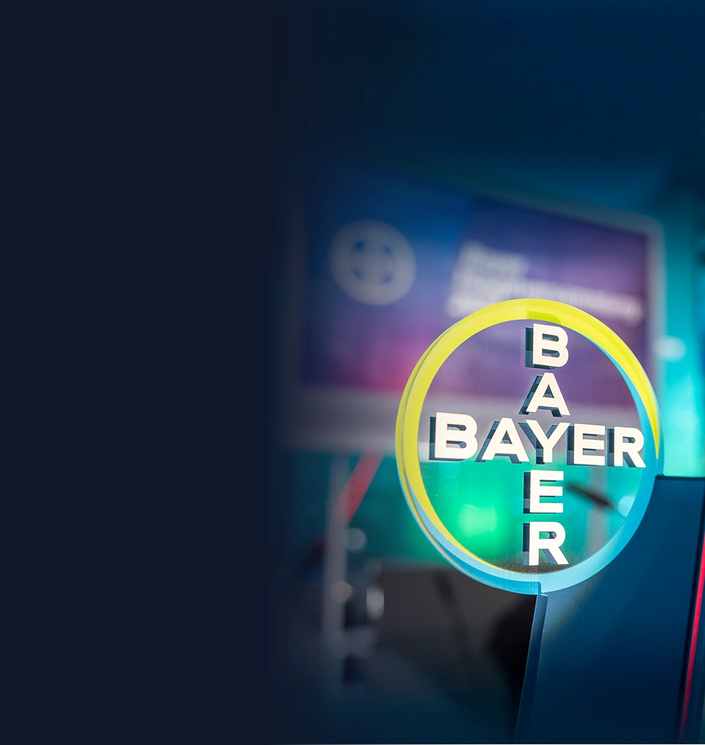 Bayer logo on a colorful background.